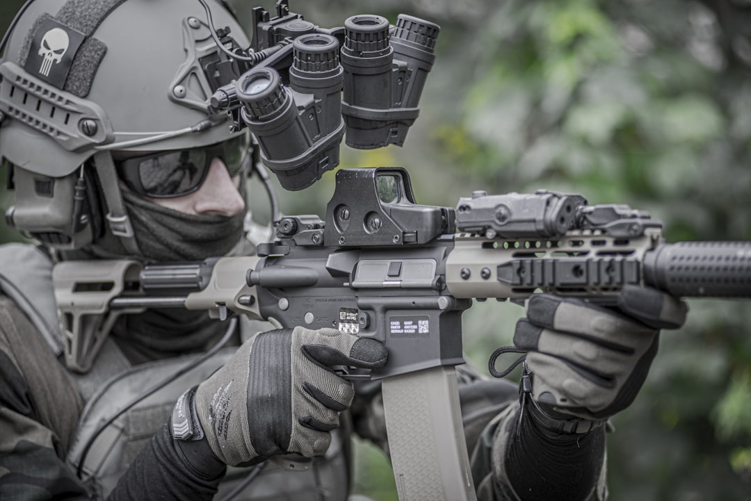 Military man, army, soldier in tactical uniform with carbine and tactical gloves.